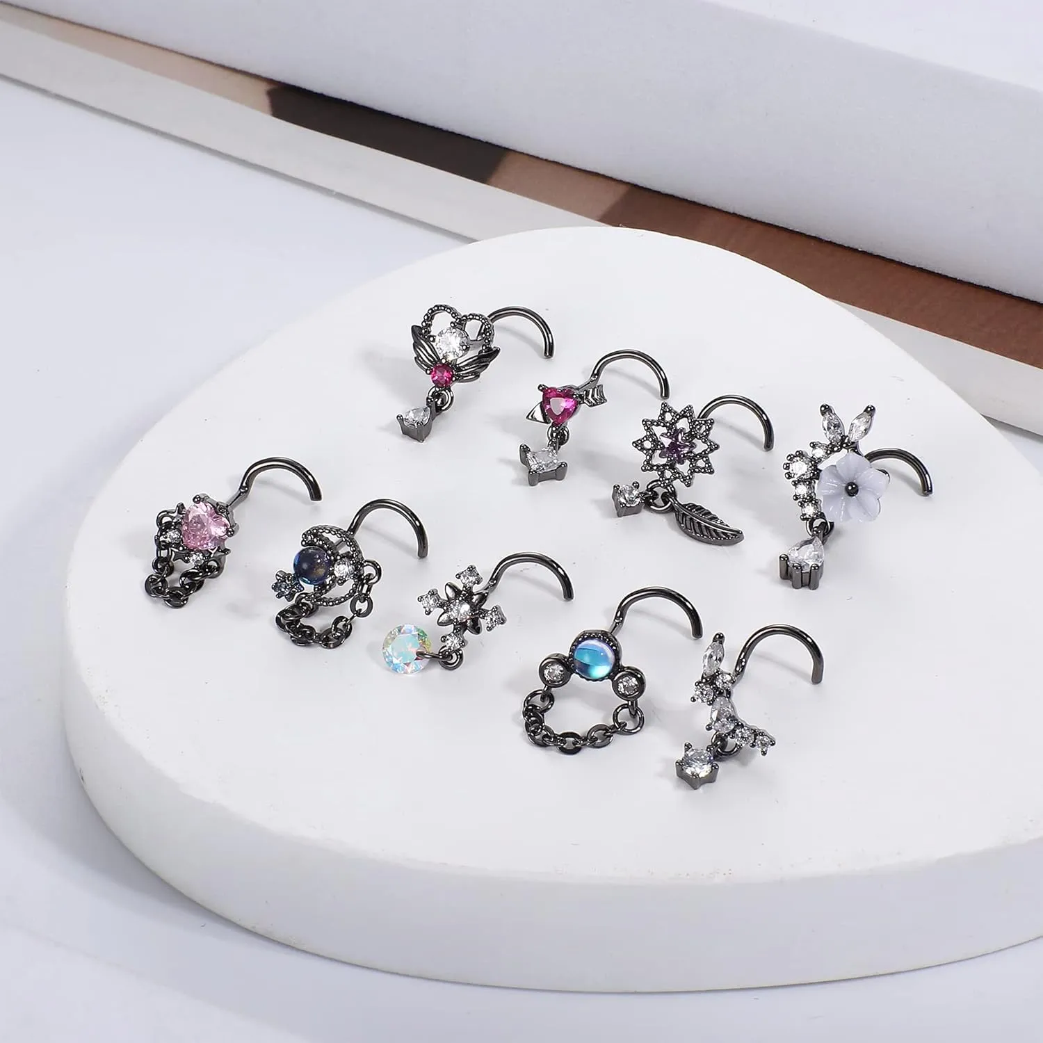 JOERICA 9 Pcs 20G Dangle Nose Rings Studs for Women Stainless Steel L Shaped Nose Studs Heart Arrow Feather Snowflake Wing CZ Dangling Nose Piercing Jewelry