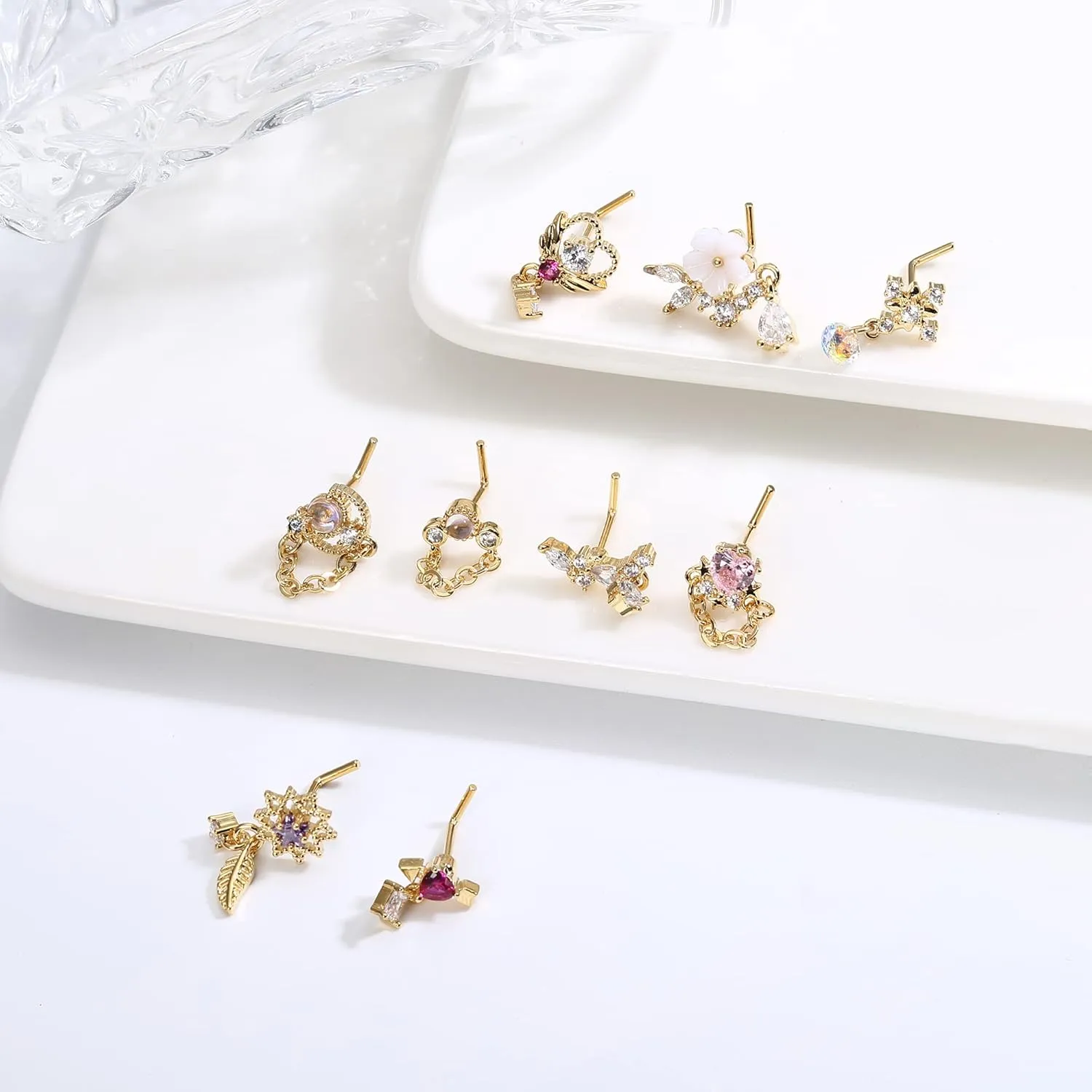 JOERICA 9 Pcs 20G Dangle Nose Rings Studs for Women Stainless Steel L Shaped Nose Studs Heart Arrow Feather Snowflake Wing CZ Dangling Nose Piercing Jewelry