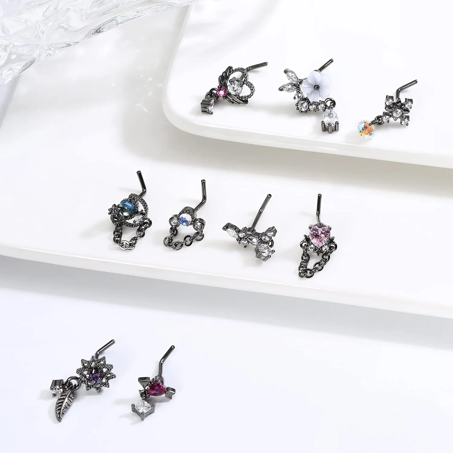 JOERICA 9 Pcs 20G Dangle Nose Rings Studs for Women Stainless Steel L Shaped Nose Studs Heart Arrow Feather Snowflake Wing CZ Dangling Nose Piercing Jewelry