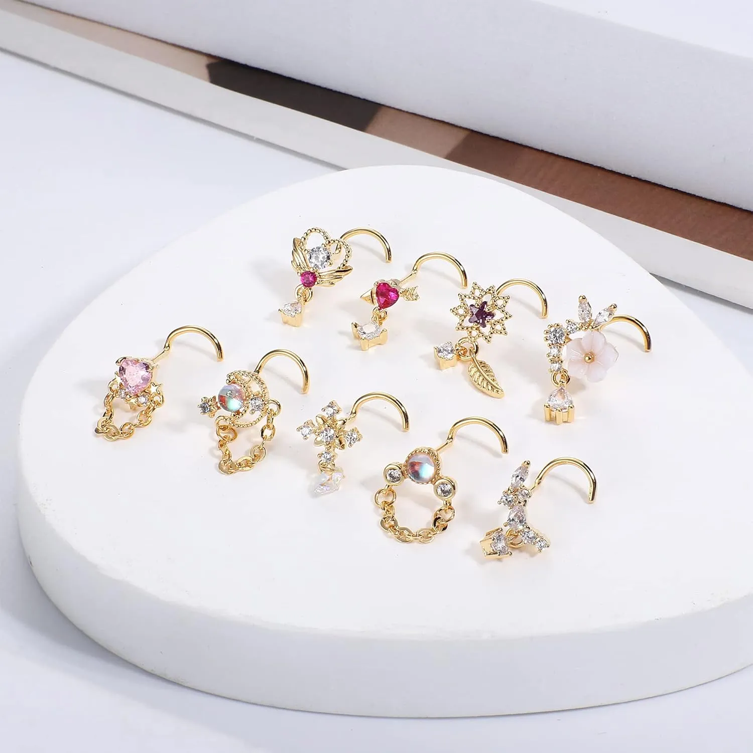 JOERICA 9 Pcs 20G Dangle Nose Rings Studs for Women Stainless Steel L Shaped Nose Studs Heart Arrow Feather Snowflake Wing CZ Dangling Nose Piercing Jewelry